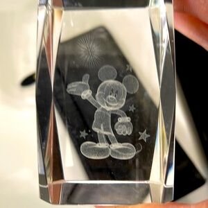 Disney Crystal Mickey etched in the center.